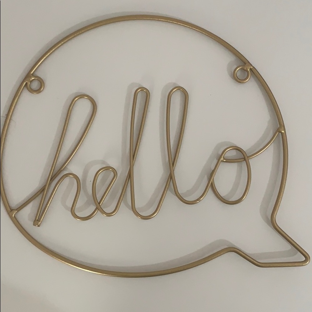 Gold “hello” wall accessory